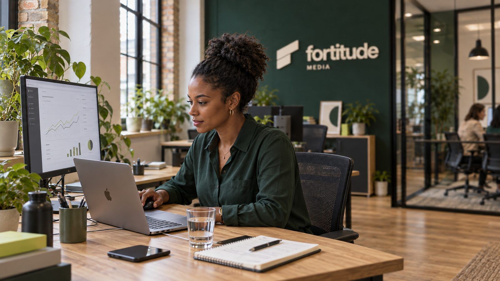An analyst working through figures at a desk